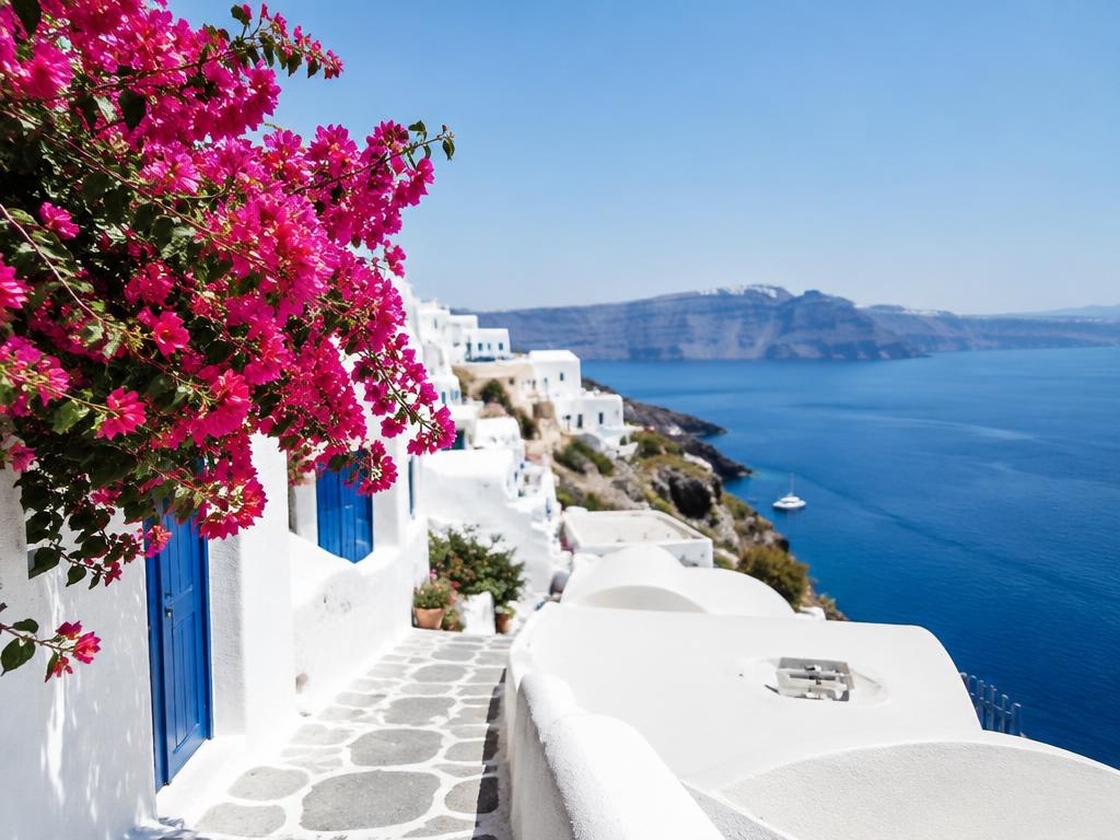 White-washed village with bougainvillea in the Greek islands